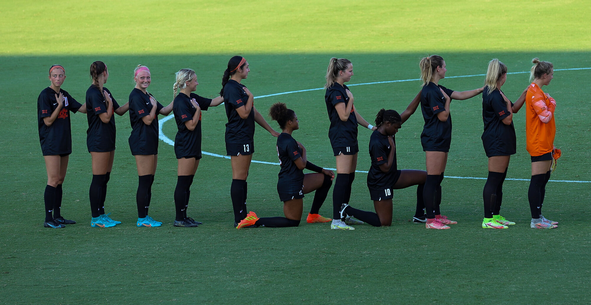 Cowgirls Standing for National Anthem